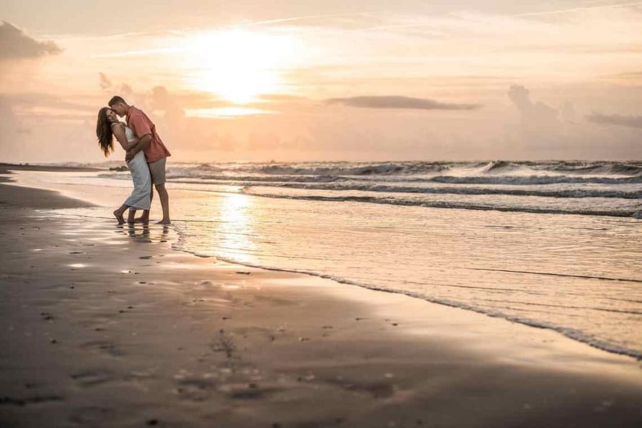 Serene sunrise at Tybee Island Beach with gentle waves and a pastel sky